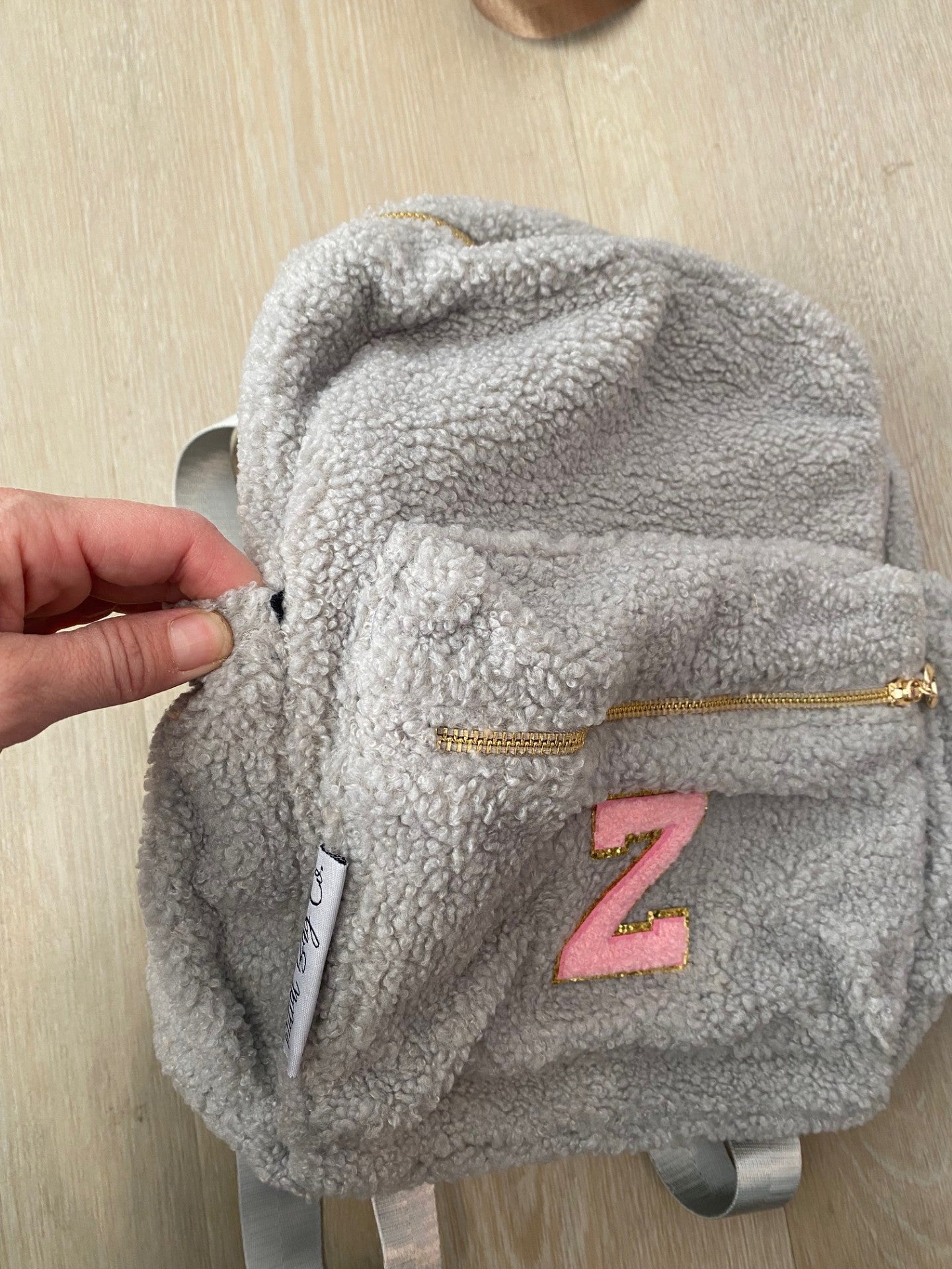 Grey with Initial 'Z' in pink **SLIGHT TEAR ON SIDE POCKET**